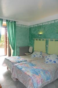 Postel nebo postele na pokoji v ubytování Hotel Font De Lauro