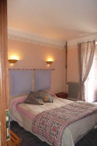 Postel nebo postele na pokoji v ubytování Hotel Font De Lauro