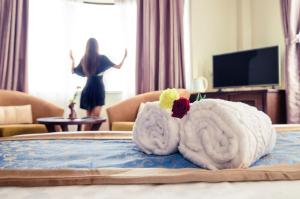 Uma televisão e/ou sistema de entretenimento em Dahlia Boutique Hotel