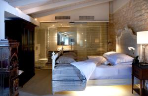 Postel nebo postele na pokoji v ubytování Torri E Merli Boutique Hotel + 37 fotografií
