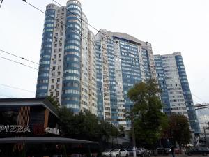 a large building with many windows in a city at IRIS apartments in Odesa