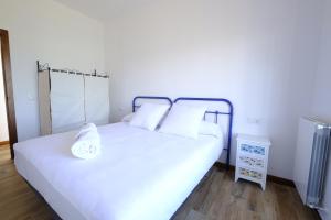 Voodi või voodid majutusasutuse Casas de Alisné toas