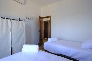 Voodi või voodid majutusasutuse Casas de Alisné toas