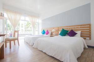 Ein Bett oder Betten in einem Zimmer der Unterkunft L'Sirene Boutique Resort