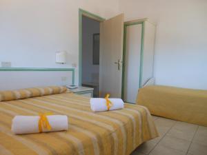 Postel nebo postele na pokoji v ubytování Hotel Due Torri