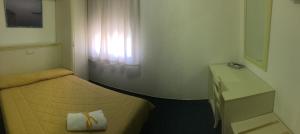 Postel nebo postele na pokoji v ubytování Hotel Due Torri