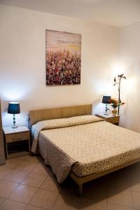 Een bed of bedden in een kamer bij Le Cascatelle