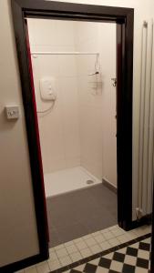 a bathroom with a shower with a white shower at Kilcommon Lodge Holiday Hostel in Belmullet