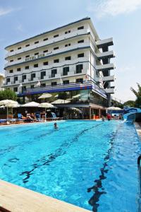 a large swimming pool in front of a hotel at Hotel Eur in Lido di Camaiore