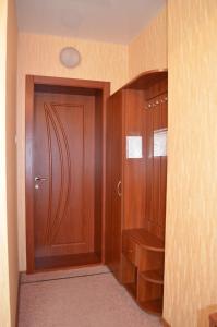 a bathroom with a toilet and a door at Sfinks in Zaporozhye
