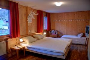 Letto o letti in una camera di Hotel Garni Hostatt