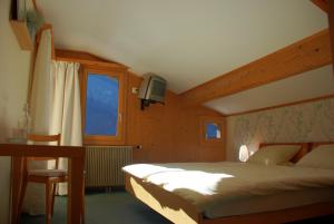 Letto o letti in una camera di Hotel Garni Hostatt