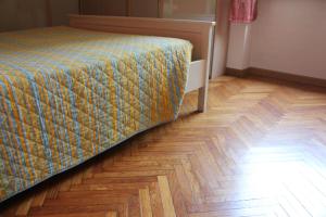 מיטה או מיטות בחדר ב-Youhome Millelire Apartment
