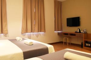 Postel nebo postele na pokoji v ubytování Ahyu Hotel + 36 fotografií