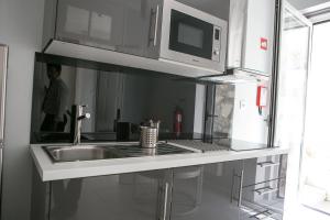 Virtuvė arba virtuvėlė apgyvendinimo įstaigoje Covelo Apartment