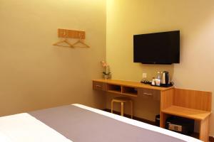 Postel nebo postele na pokoji v ubytování Ahyu Hotel