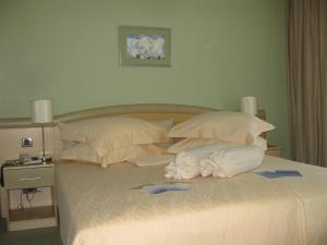 Кровать или кровати в номере Hotel Kimen