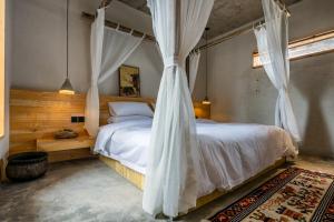 Postelja oz. postelje v sobi nastanitve Shangri-La Karesansui Hotel