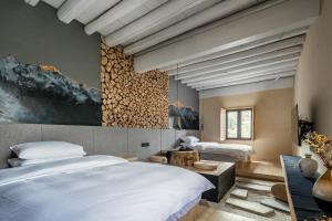 Postelja oz. postelje v sobi nastanitve Shangri-La Karesansui Hotel