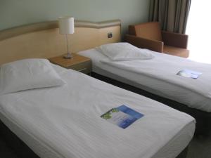 Кровать или кровати в номере Hotel Kimen