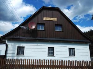 a barn with a satellite on the side of it at Chata Alexandra in Malá Morávka