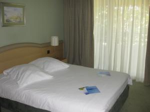 Кровать или кровати в номере Hotel Kimen