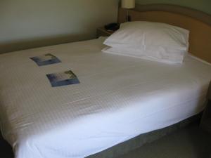 Кровать или кровати в номере Hotel Kimen