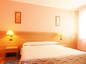 Postel nebo postele na pokoji v ubytování Hotel Ristorante Al Bassanello