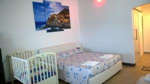 Giường trong phòng chung tại Borgo Foce La Spezia SP2389