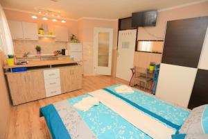 a kitchen with two beds in a room at Apartment Centar in Pula