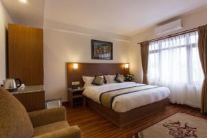 Letto o letti in una camera di Oasis Kathmandu Hotel
