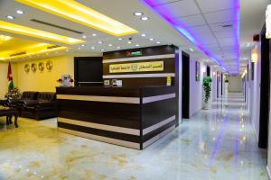 a lobby of a hotel with a reception desk at Qaser Al-Sultan Hotel Suites in Amman