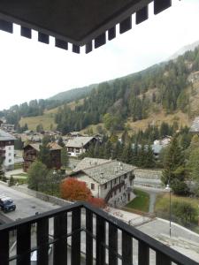 a view from a balcony of a town with a mountain at Monolocale Monterosa in Champoluc