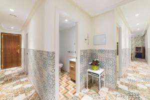 a bathroom with a toilet and a sink at El Jardín del Ángel Lavapies in Madrid