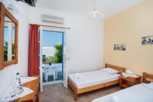 Posteľ alebo postele v izbe v ubytovaní Fragos Apartments