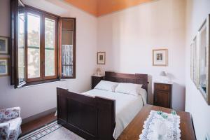 Een bed of bedden in een kamer bij La Casetta Di Filippo E Chiara