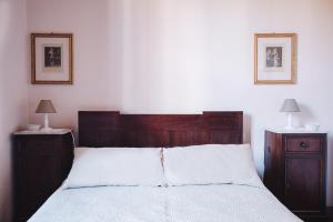 Een bed of bedden in een kamer bij La Casetta Di Filippo E Chiara