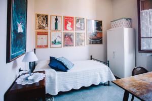 Een bed of bedden in een kamer bij La Casetta Di Filippo E Chiara