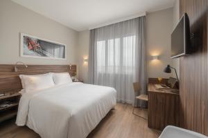 Postel nebo postele na pokoji v ubytování Intercity Pátio Pinda Hotel & Resort
