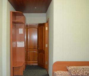 a bedroom with a bed and a desk at Sfinks in Zaporozhye