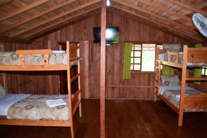 Postel nebo postele na pokoji v ubytování Hosteria Kindi Wasi