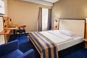 Postel nebo postele na pokoji v ubytování IntercityHotel Celle + 18 fotografií