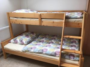 Posteľ alebo postele v izbe v ubytovaní PENZION HNAČOV
