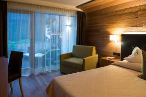 Posteľ alebo postele v izbe v ubytovaní Hotel Grien