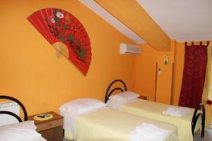 Een bed of bedden in een kamer bij La Conca D'oro