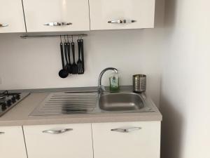 a kitchen with a sink and a counter top at Villa Jobè in Polignano a Mare +51 photos