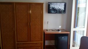 A television and/or entertainment centre at Villa Betta