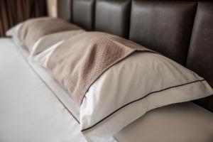 Ein Bett oder Betten in einem Zimmer der Unterkunft Caixa D'aço Exclusive Hotel