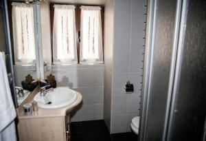 a bathroom with a sink and a toilet at Casa Rural Tolareta in Arantza