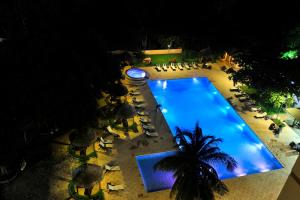 an overhead view of a swimming pool at night at Sopatel Silmandé in Ouagadougou